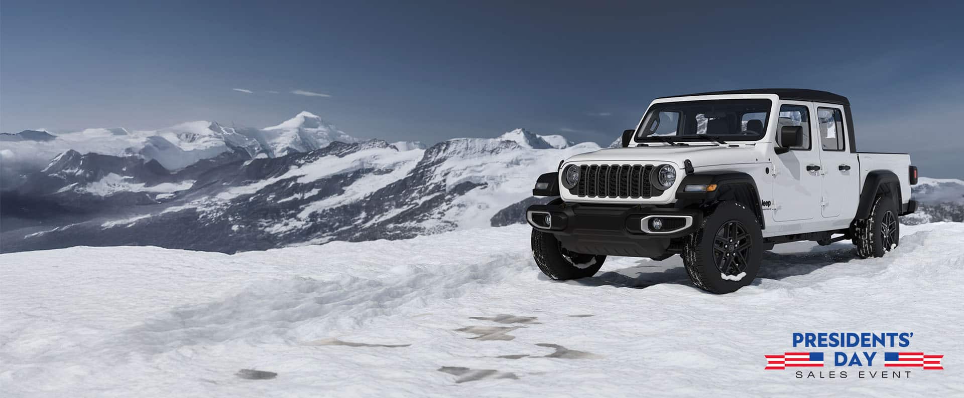 A white 2026 Jeep Gladiator Sport S with black soft top, parked on a snow-covered clearing, high in the mountains. The Presidents' Day Sales Event.