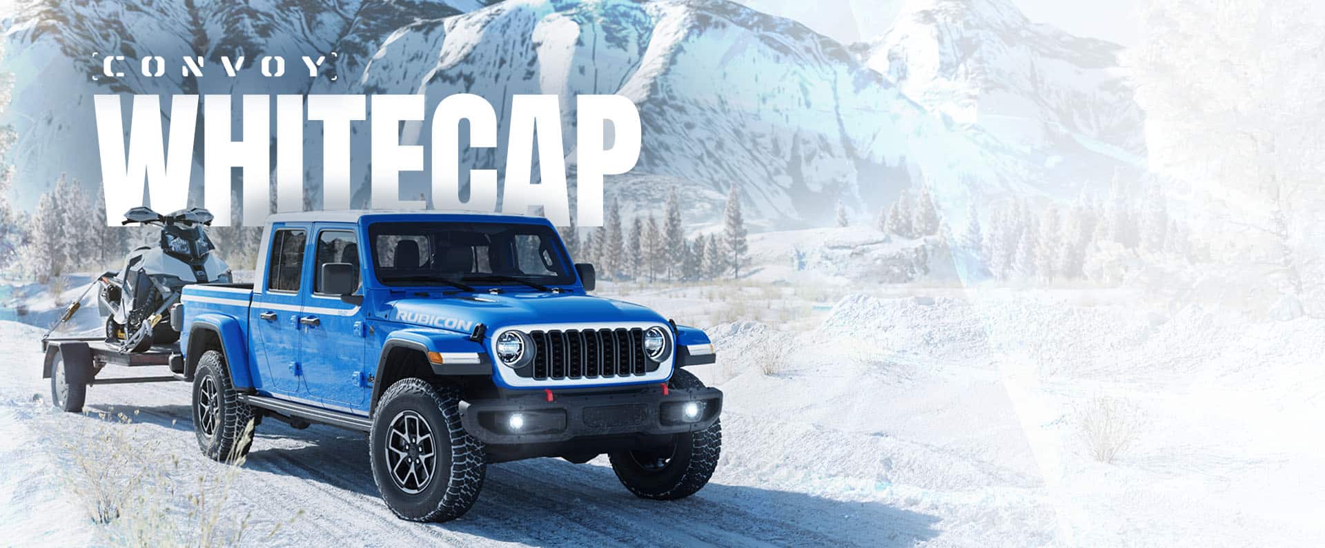 A passenger-side front angle of a blue 2026 Jeep Gladiator Rubicon Whitecap traveling on a snow-covered trail, towing an ATV on a flatbed trailer with a forest and mountains in the background. Convoy. Whitecap.