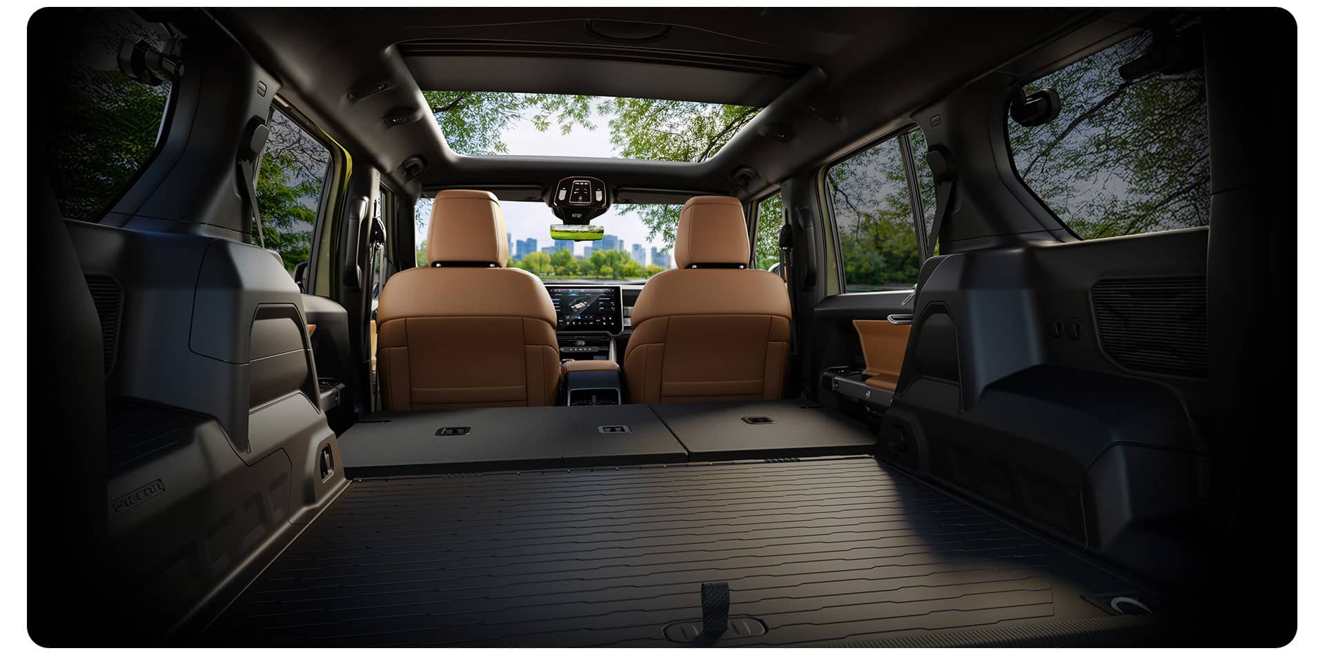 The large cargo area of the 2026 Jeep Recon, from the rear of the vehicle, with the rear seats folded, expanding the space even further.