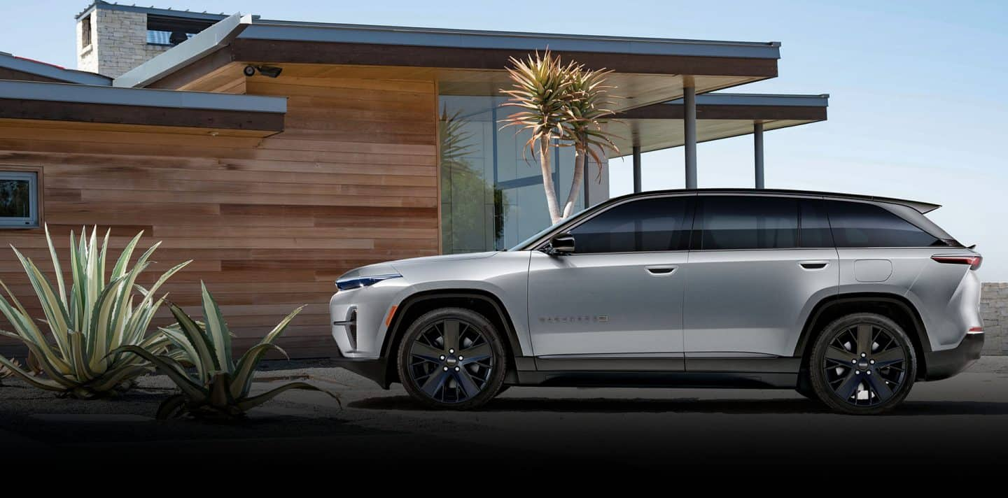 On the left, an angled passenger-side profile of a black 2024 Jeep Wagoneer S Obsidian with the background blurred. In the middle, an angled passenger-side profile of a silver 2024 Jeep Wrangler Rubicon 4xe with a star-filled background. On the right, an angled driver-side profile of a white 2024 Jeep Grand Cherokee Summit Reserve 4xe parked on a clearing off-road at night, with the northern lights in the background.