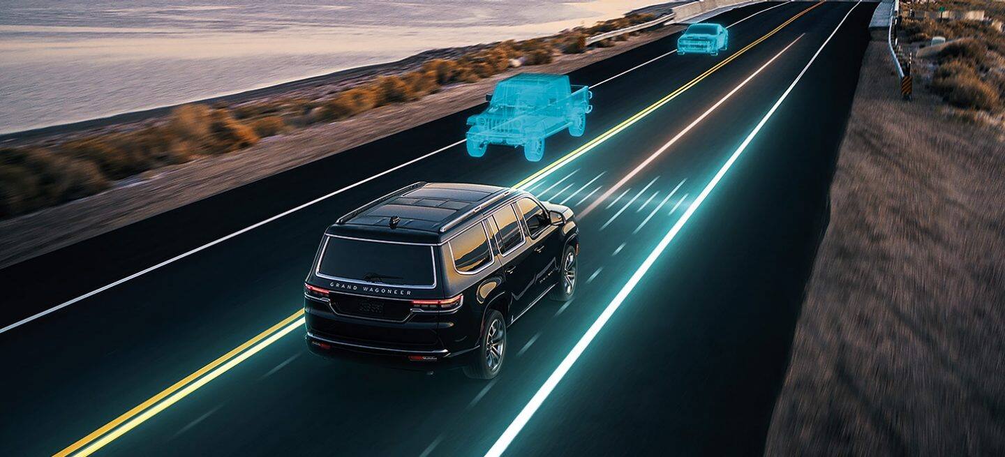 Primer plano de los controles en el volante del Jeep Grand Wagoneer 2025.