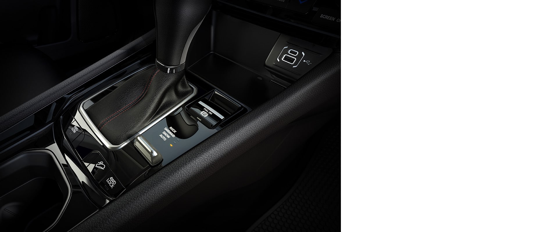 The center console in the 2024 Jeep Compass Trailhawk including the shifter, Selec-Terrain Traction Management System dial and wireless charging pad.