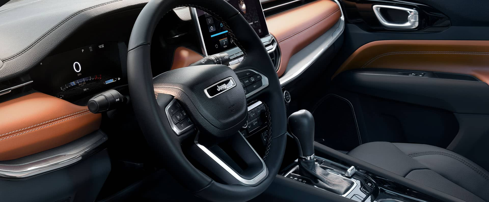 The steering wheel and Driver Information Digital Cluster Display in the 2024 Jeep Compass Limited.