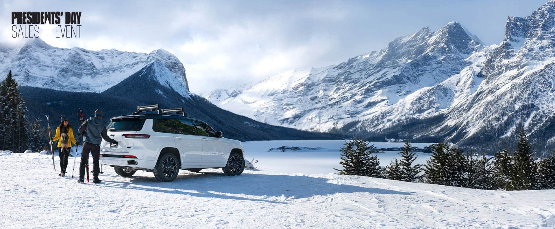 A 2025 Jeep Grand Cherokee model parked on a snowy clearing, with mountains in the background. President's day Event.