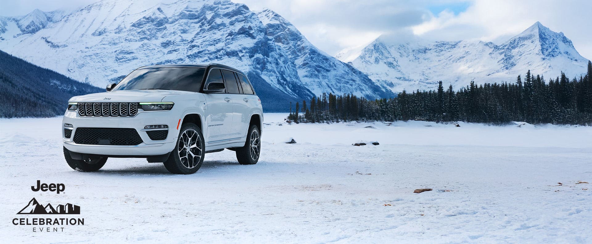 A 2025 Jeep Grand Cherokee model parked on a snowy clearing , with mountains in the background. Celebration event.