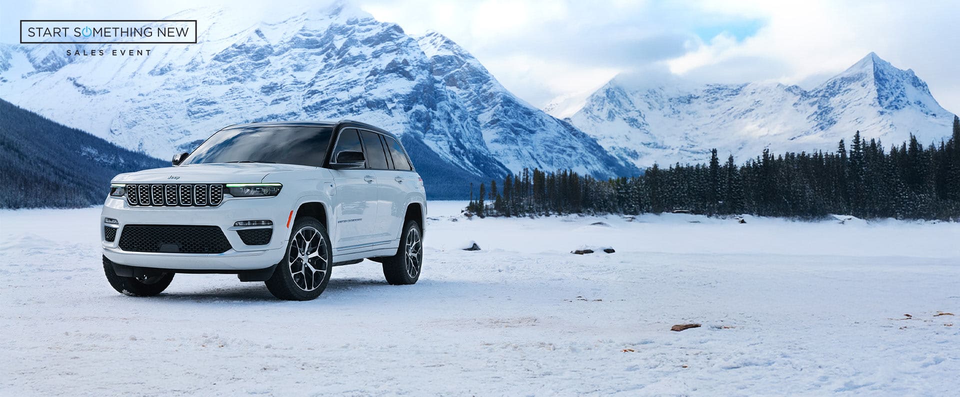 A 2025 Jeep Grand Cherokee model parked on a snowy clearing , with mountains in the background. Start Something New Sales Event logo.