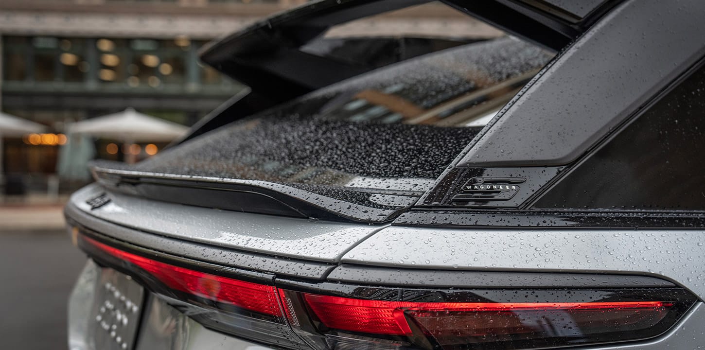 The rain-covered rear window and spoiler on a 2025 Jeep Wagoneer S Launch Edition.