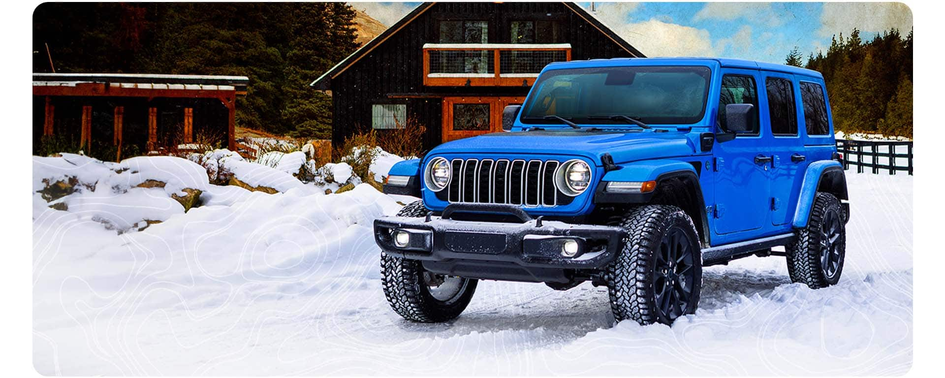 A blue 2025 Jeep Wrangler Backcountry 4xe parked traveling on a snow-covered road in the mountains.