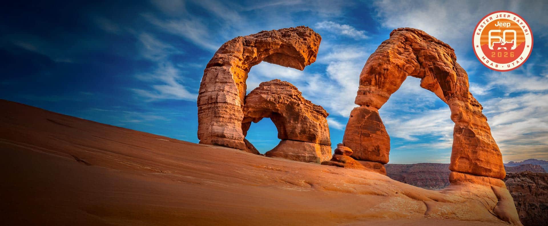 Sandstone formations in the desert pieced together to resemble the number 60. Easter Jeep Safari. Jeep 60 2026. Moab, Utah.