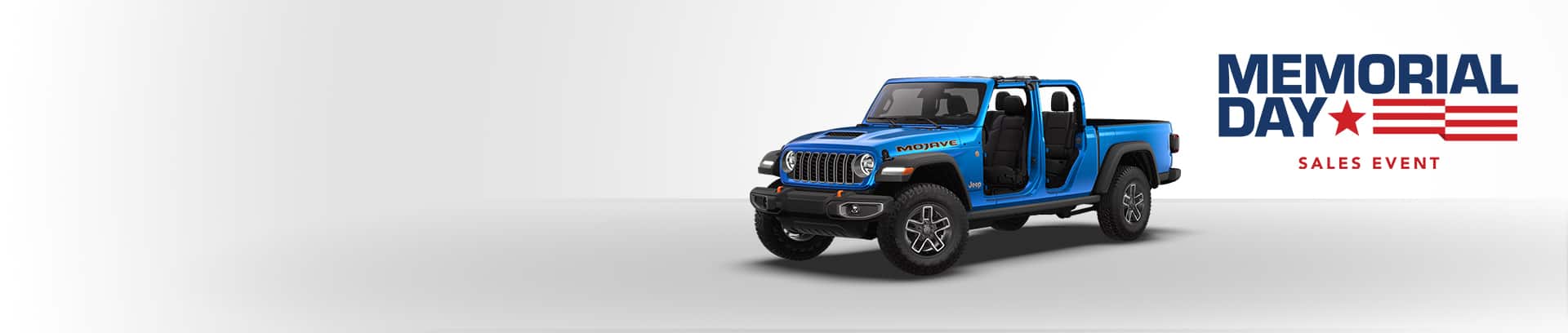 A blue 2026 Jeep Gladiator Mojave with its doors and top removed. Memorial Day Sales Event.
