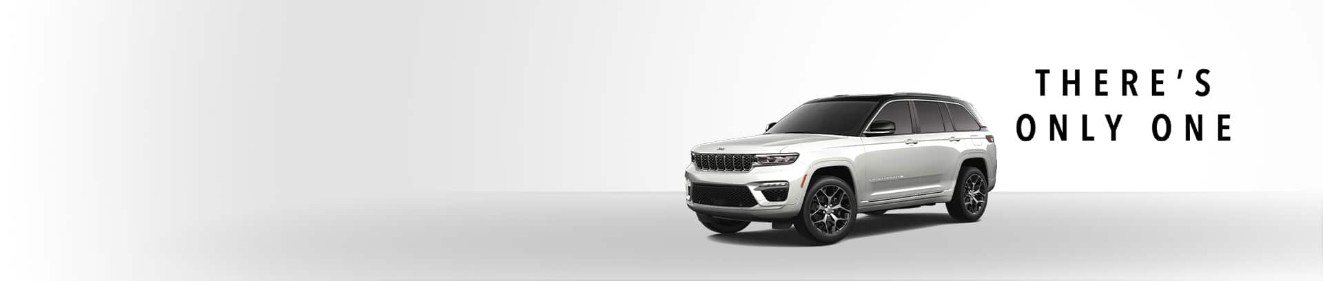 A white 2025 Jeep Grand Cherokee Summit Reserve.