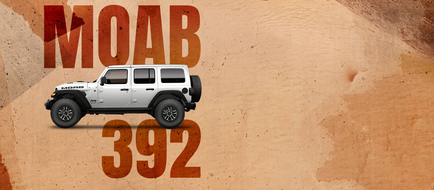 A driver-side front angle of a drab olive green 2026 Jeep Wrangler Moab 392. Moab 392.